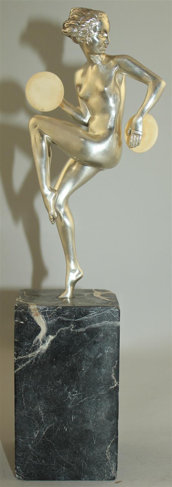 An Art Deco silvered bronze figure of a nude female dancer, overall 12.5in.